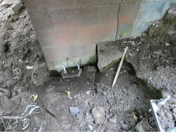 illustration of underpinning foundation crack repair with helical pier