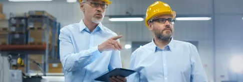 two engineers in yellow hard hats