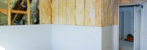 Home Renovation Room with exposed beams and sheet rock