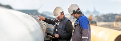 Men looking at materials